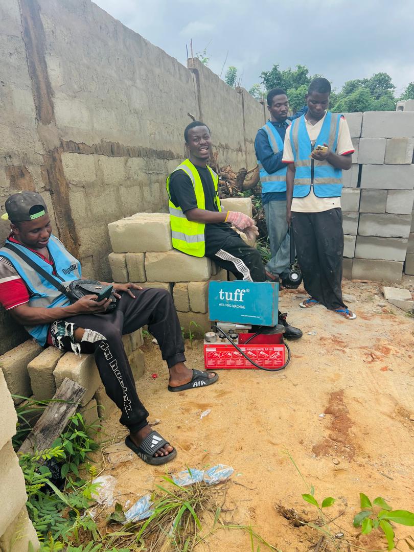 DYP technicians with professional tools at an active project site