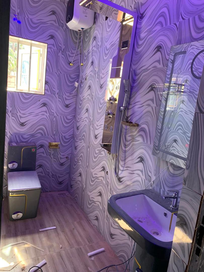 Completed DYP bathroom with installed toilet, bath and shower fixtures