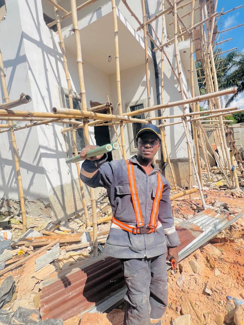DYP technician wearing safety equipment on an active construction site