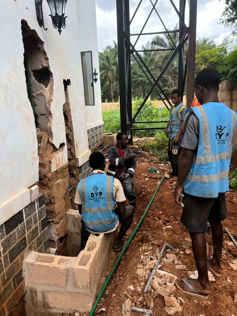 DYP team collaborating on an exterior plumbing project