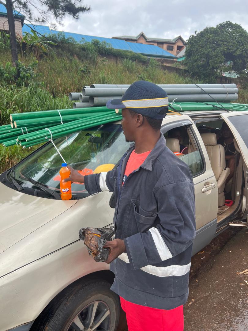 DYP technician transporting organized plumbing pipes to a project